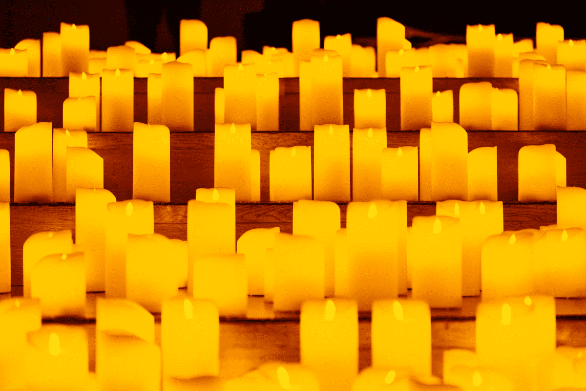 A close-up shot of candles on display on steps.