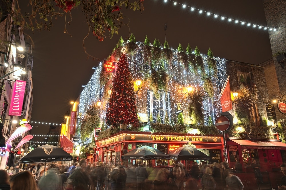 The Temple Bar in Dublin, covered in fairylights and Christmas decorations.