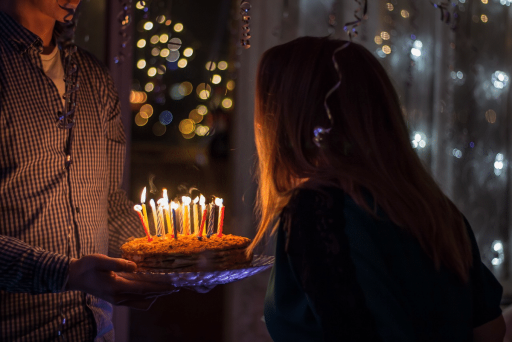 Woman blowing out her candles on her birthday