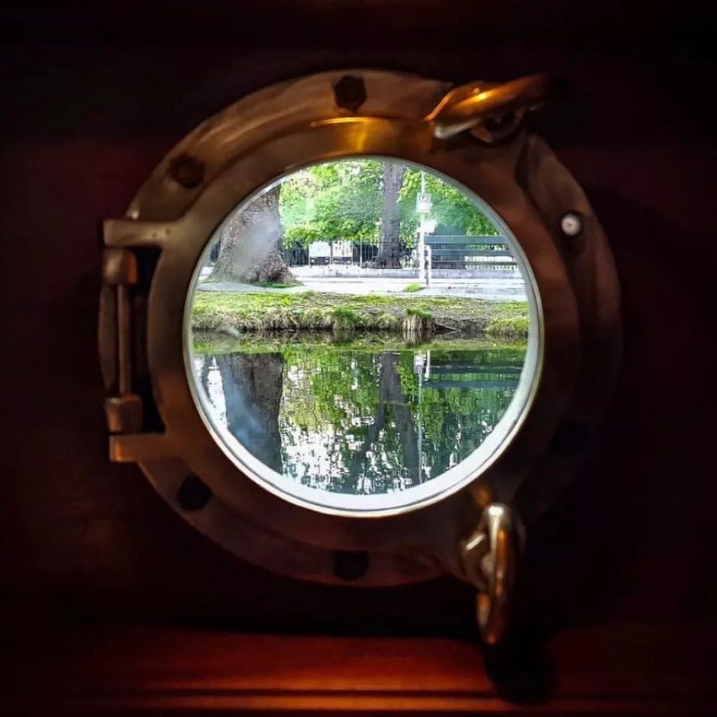 A view of Dublin's Grand Canal through a porthole in La Peniche.